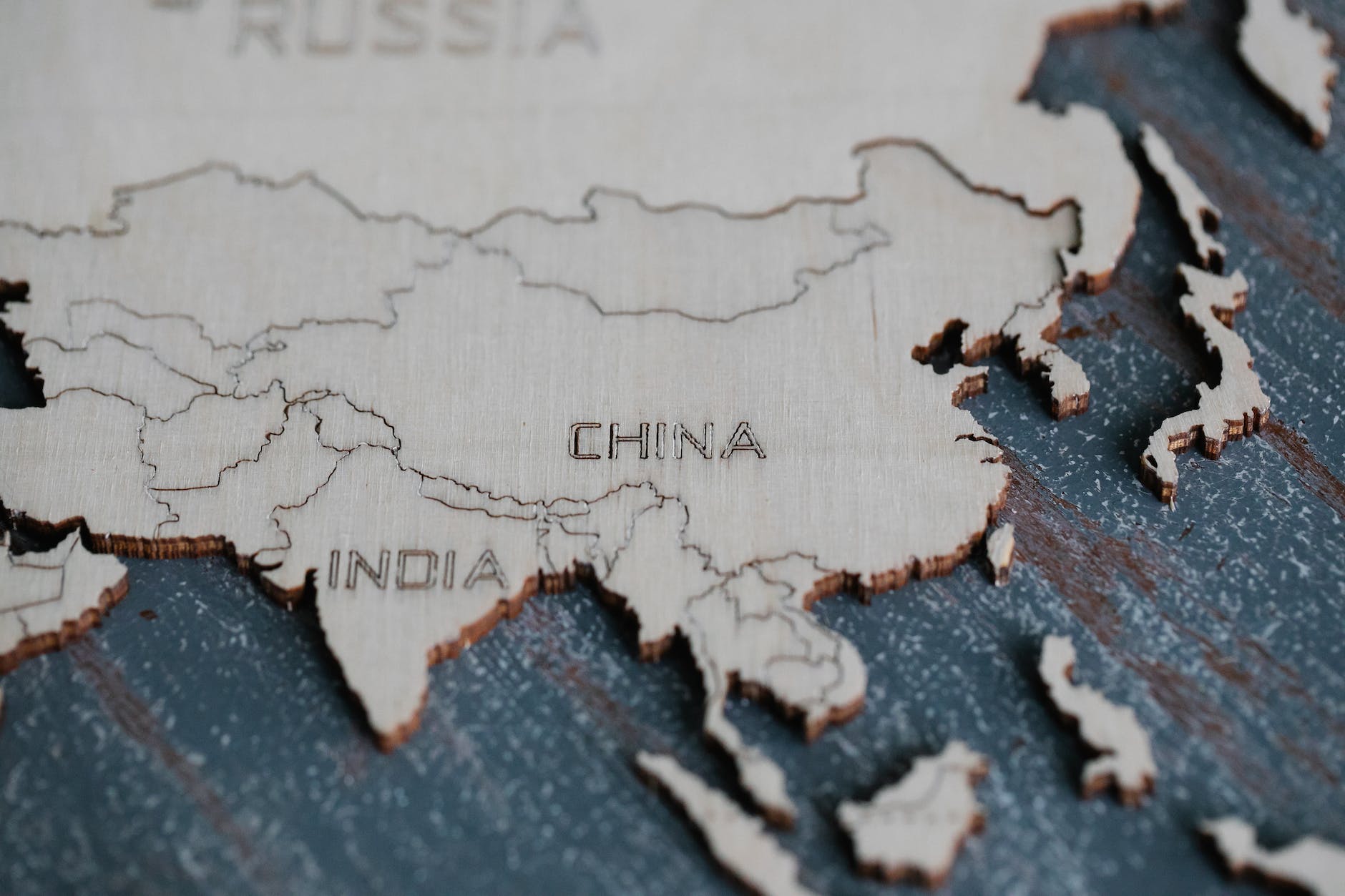 close up of countries on wooden map