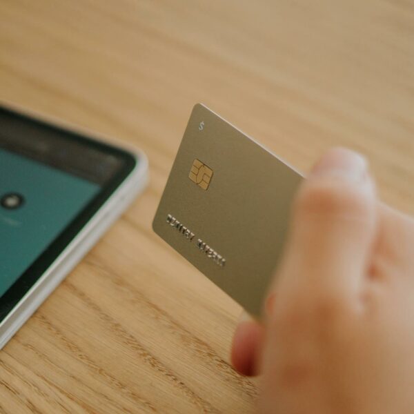 close up shot of a person holding a credit card