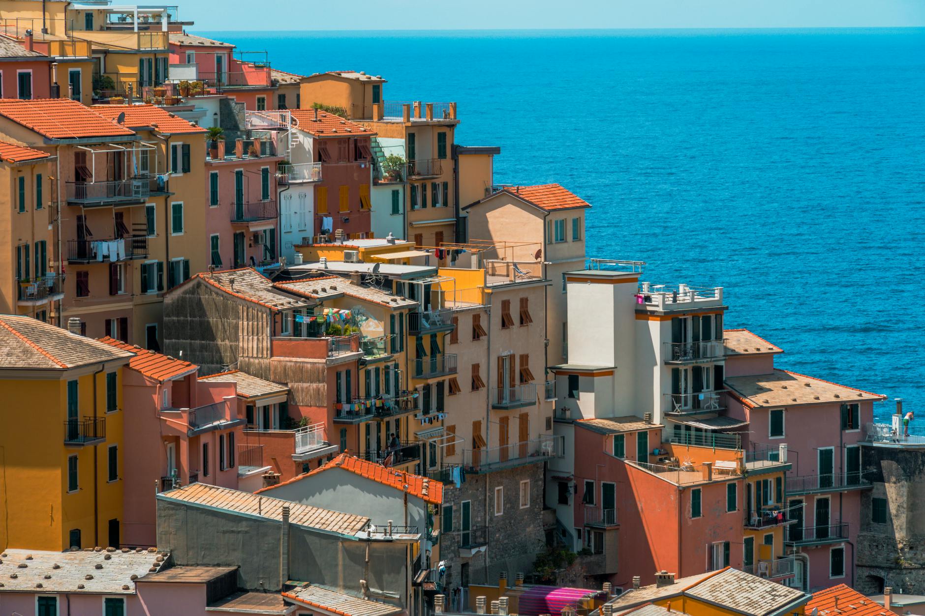 view of cliffside houses in one of the cinque terre towns on the ligurian sea shore in italy